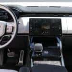 2025 Range Rover Sport interior showcasing advanced technology features, including a digital display, premium controls, and intuitive infotainment system.
