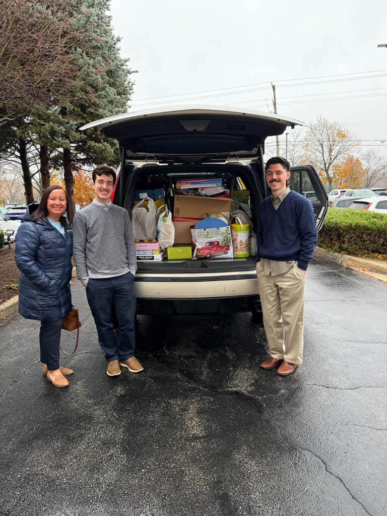 Land Rover Naperville staff contributing toys to support the Schaumburg Holiday Toy Drive.