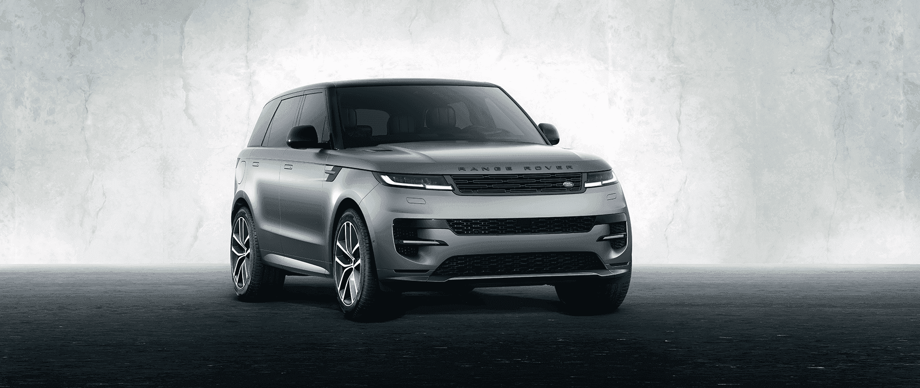 Image features Silver Range Rover Sport.
