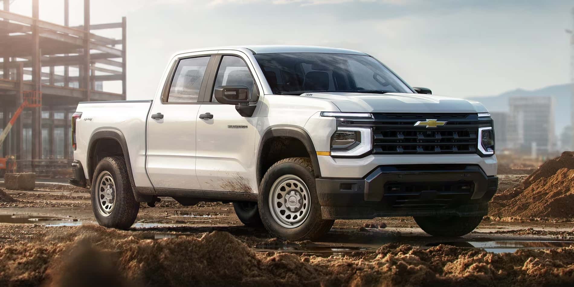 White 2027 Chevrolet Silverado 1500 Work Truck exterior at a construction site