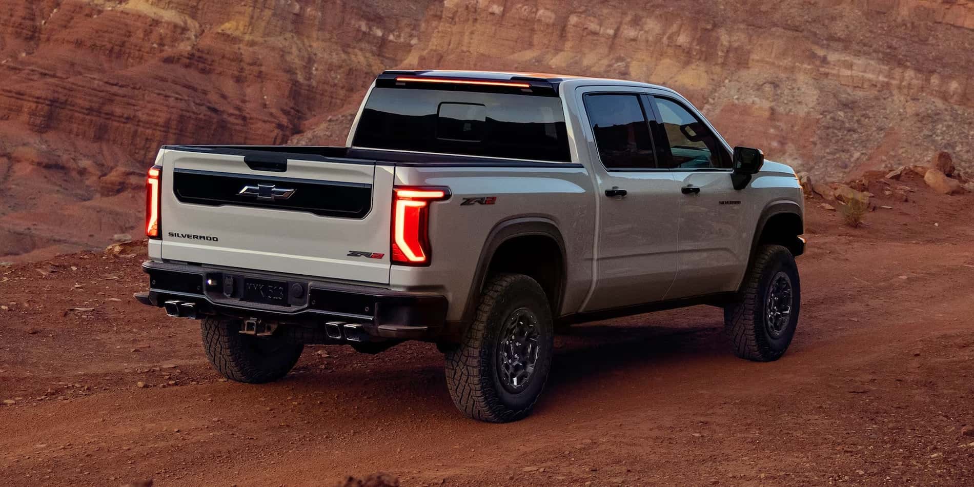 Gray 2027 Chevrolet Silverado 1500 ZR2 exterior rear view in a canyon