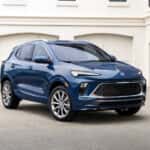 Blue 2024 Buick Encore GX Avenir parked on a driveway