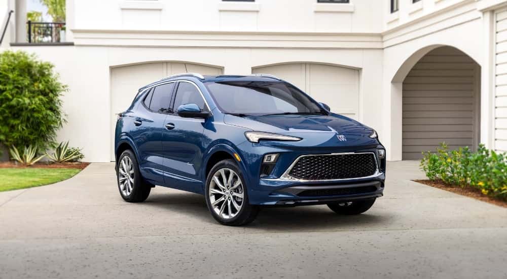 Blue 2024 Buick Encore GX Avenir parked on a driveway