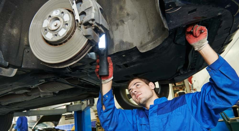 Technician doing a brake inspection