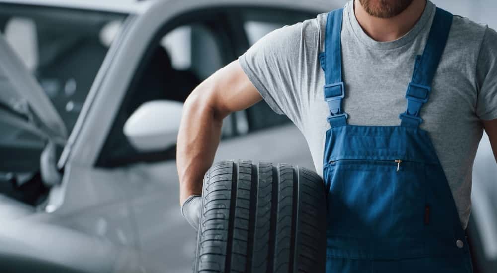 Technician holding a tire