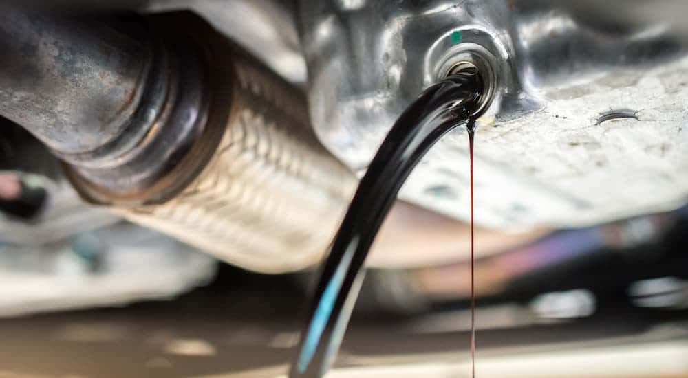 Oil draining from a vehicle are a Buick service center in Cincinnati