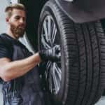 Technician installing a tire