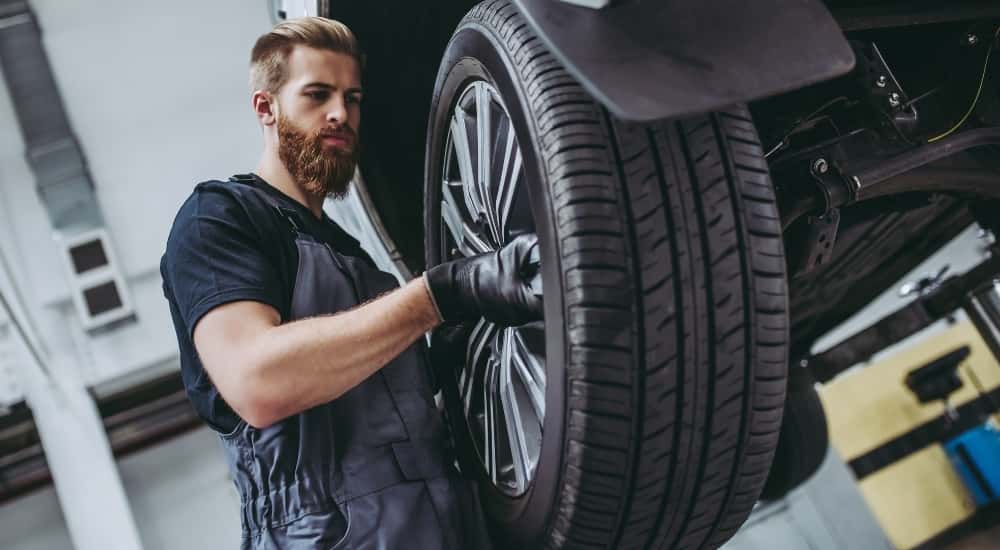 Technician installing a tire