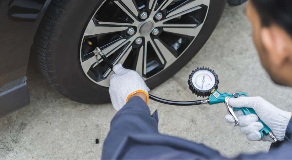 Technician inflating a tire