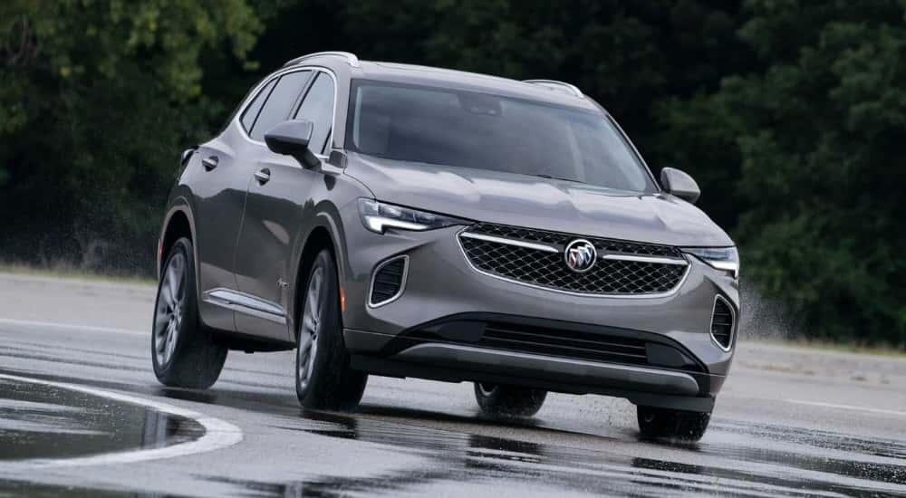 Grey 2023 Buick Envision Avenir rounding a corner