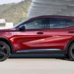 Red 2025 Buick Envision ST parked near a Buick service center near Covington