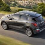 Grey 2017 Buick Encore driving on an open road