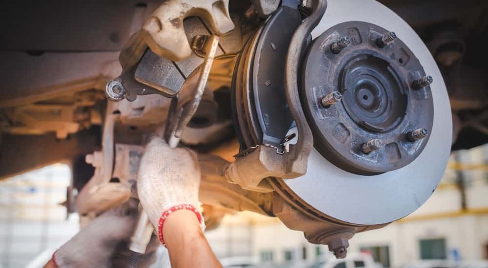 Mechanic performing brake service