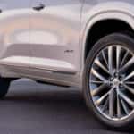 Passenger side wheels on a white 2025 Buick Enclave Avenir