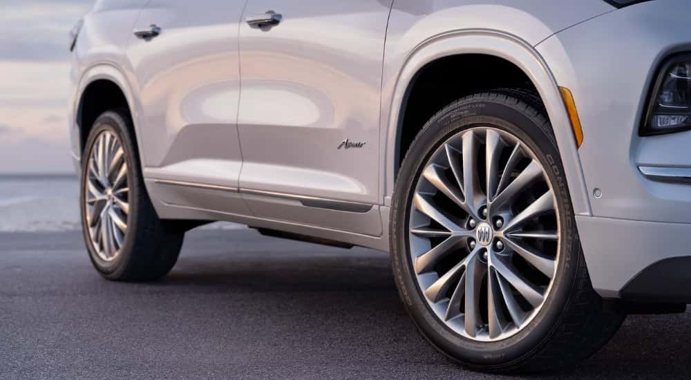 Passenger side wheels on a white 2025 Buick Enclave Avenir