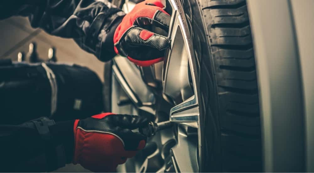 Technician installing a tire