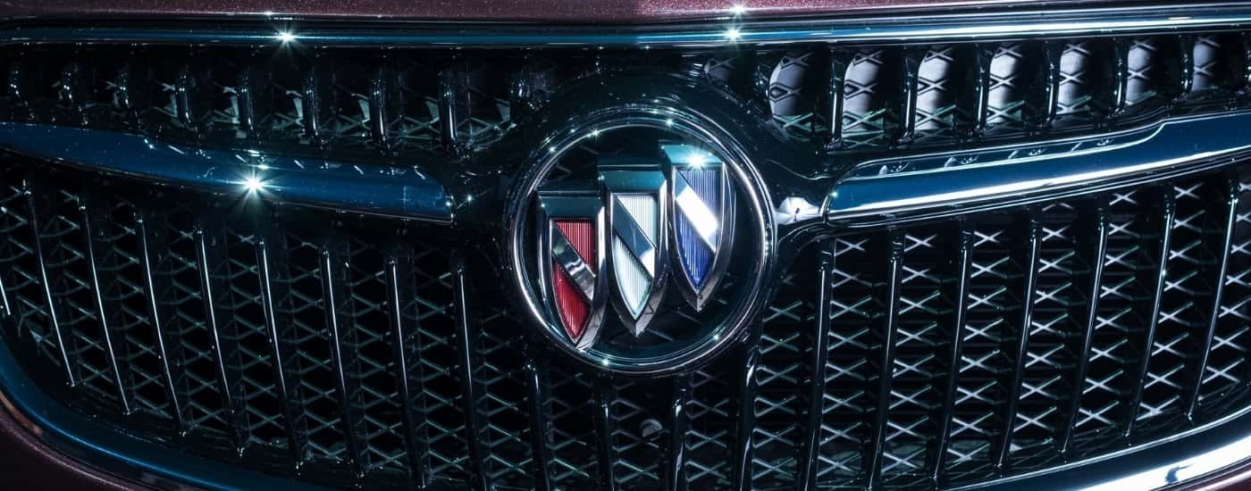 Badge on the grille of a purple 2017 Buick Encore