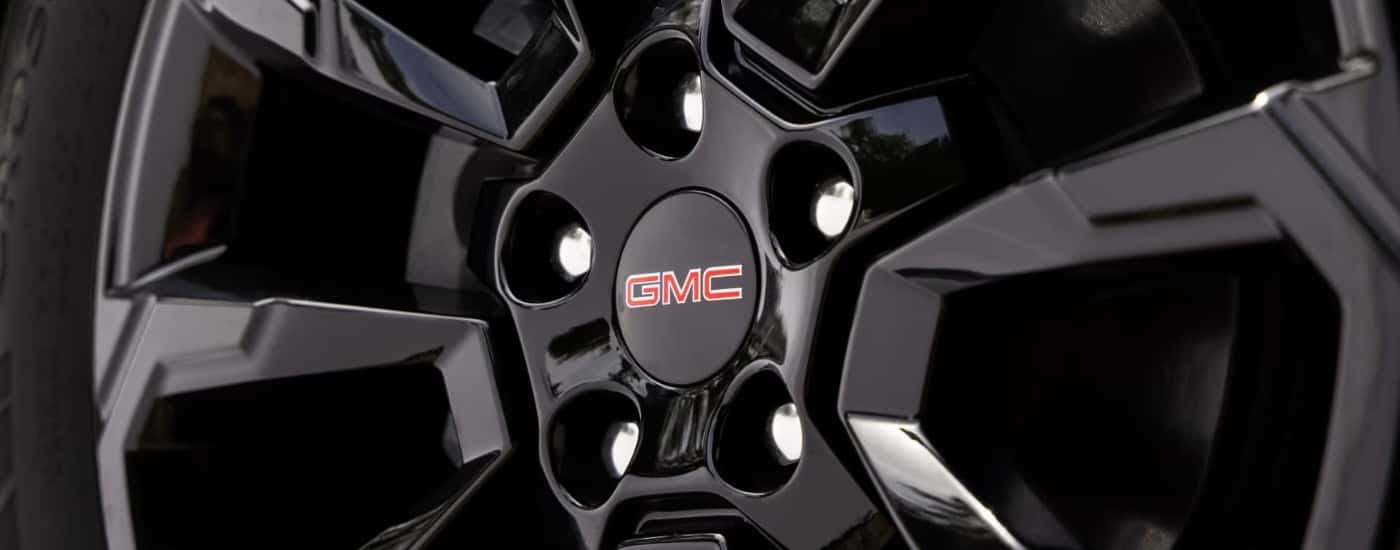 Black rim on a 2025 GMC Terrain Elevation at a GMC service center near Covington
