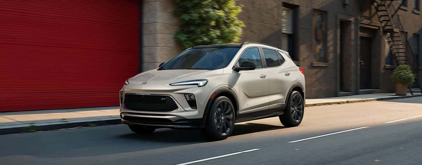 A gray 2026 Buick Encore GX driving in a city