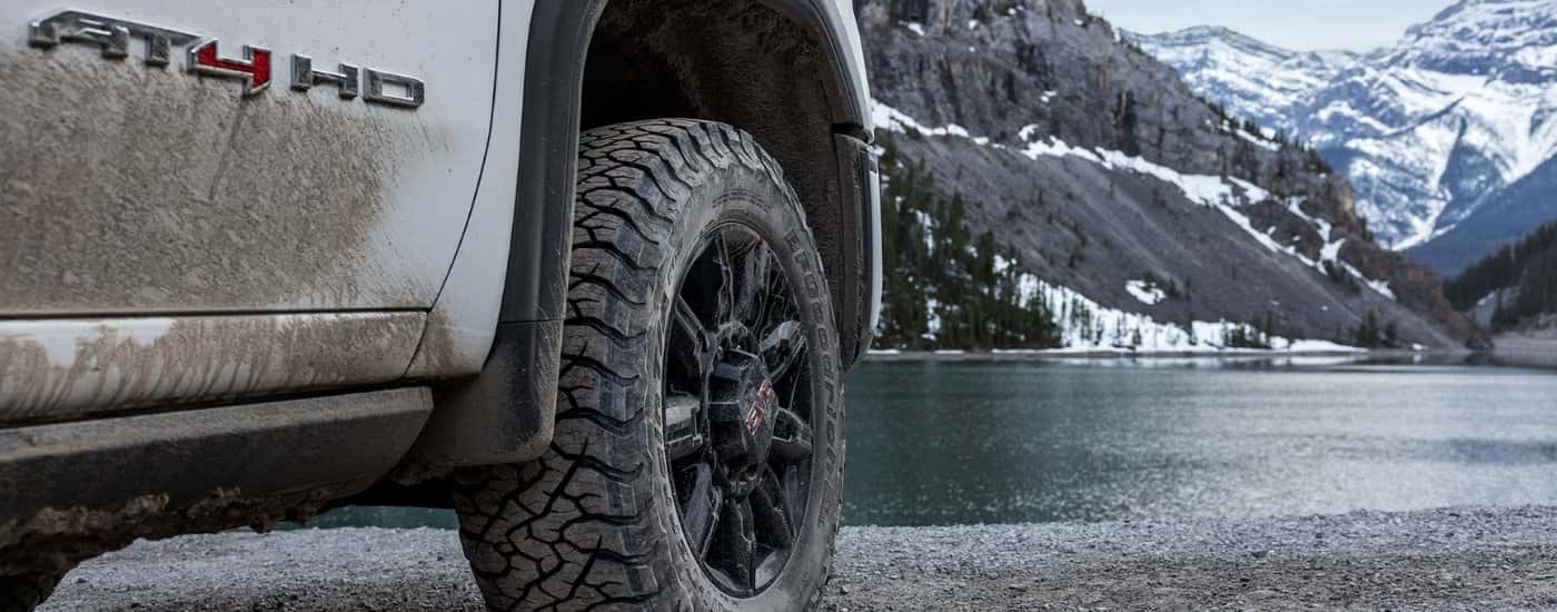 White 2026 GMC Sierra 2500 HD AT4 parked near a lake