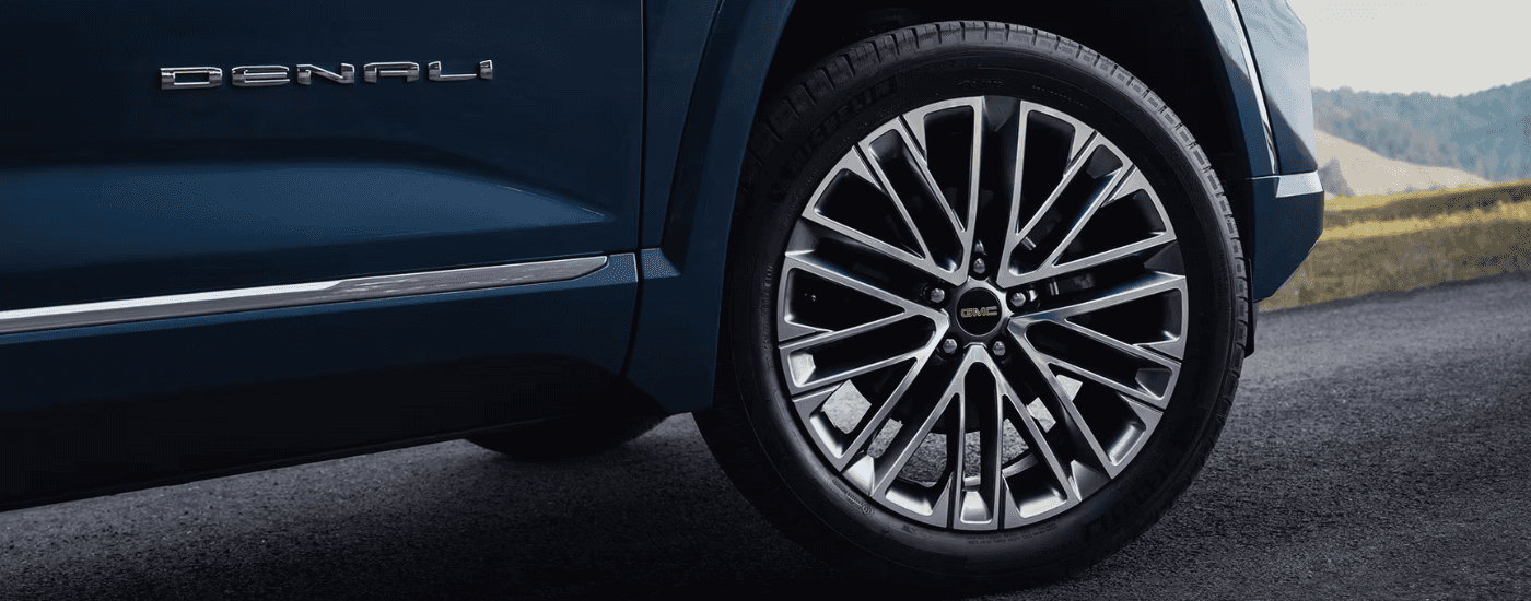 Wheel of a blue 2026 GMC Terrain Denali