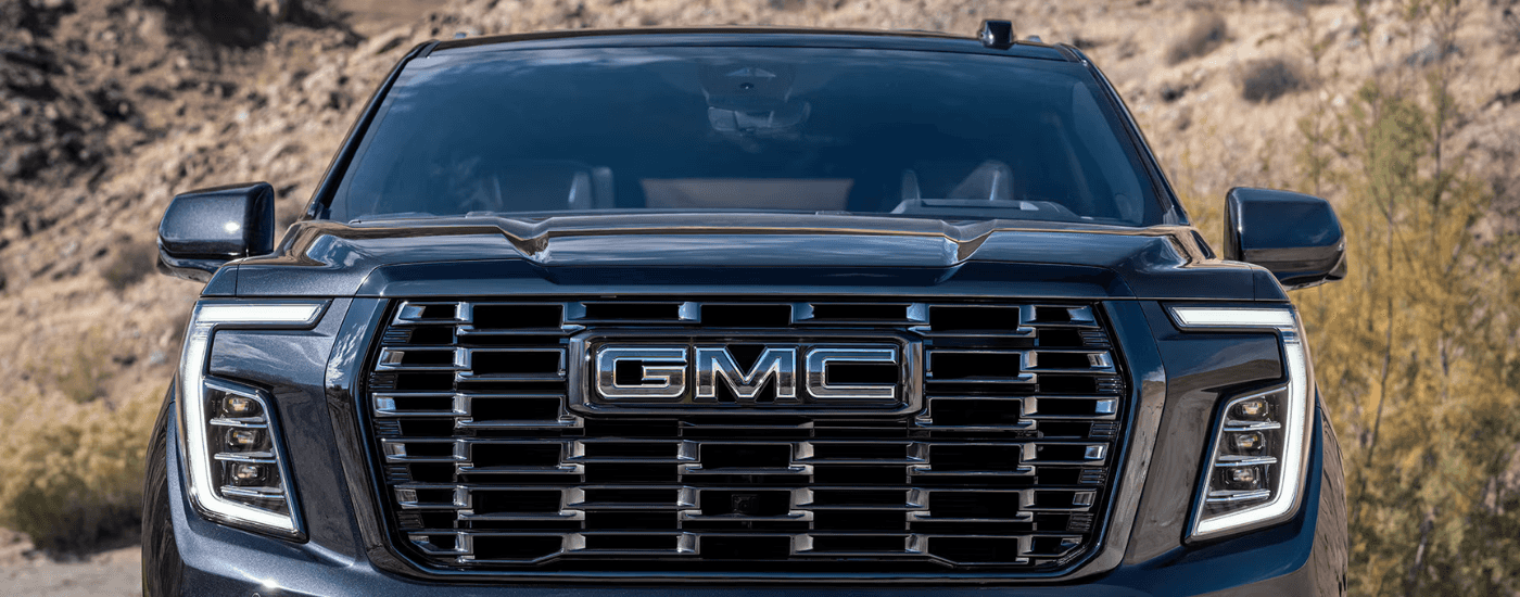 Grille of a black 2026 GMC Yukon