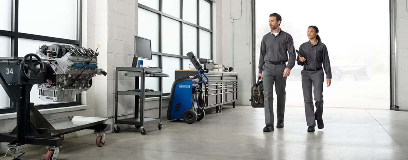 Technicians walking through a service bay