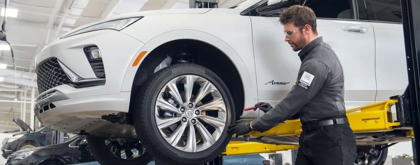 Technician performing an inspection at a Buick service center
