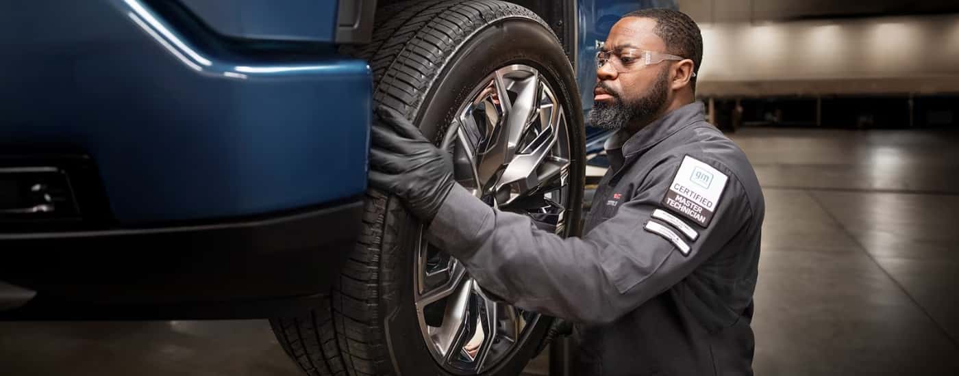 Technician checking the wheel on a vehicle