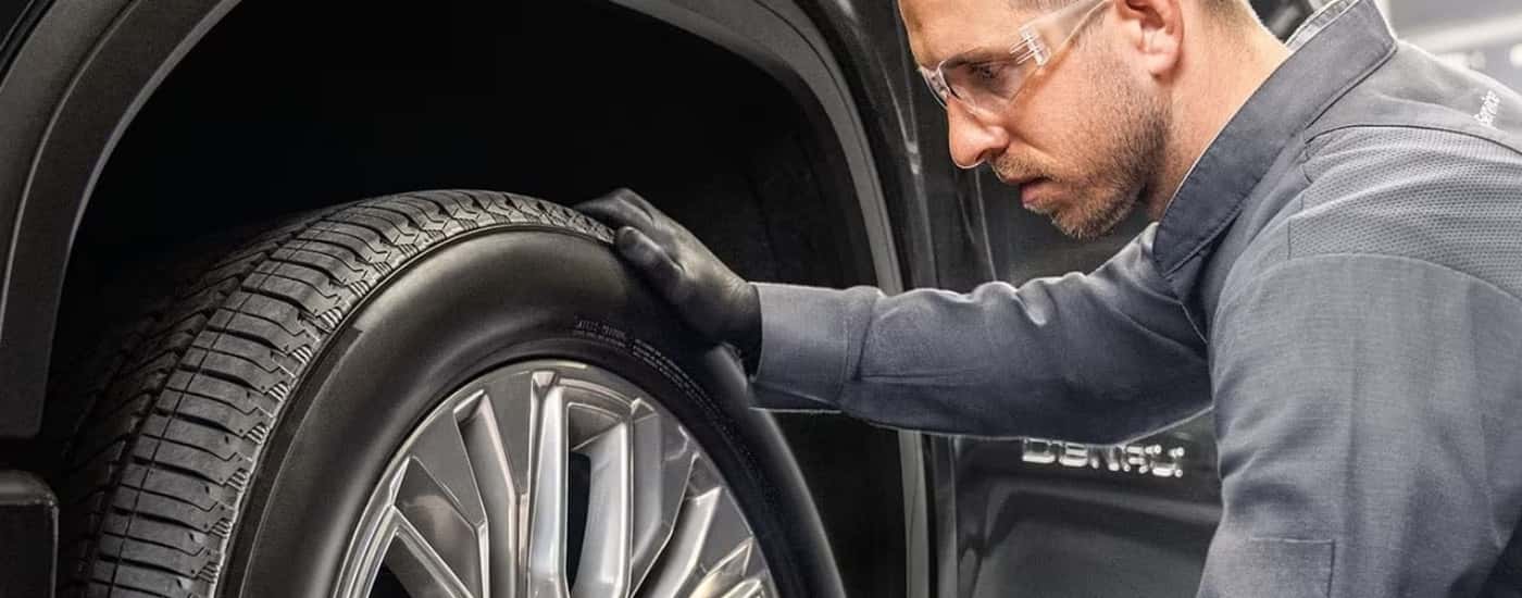 Technician installing a tire