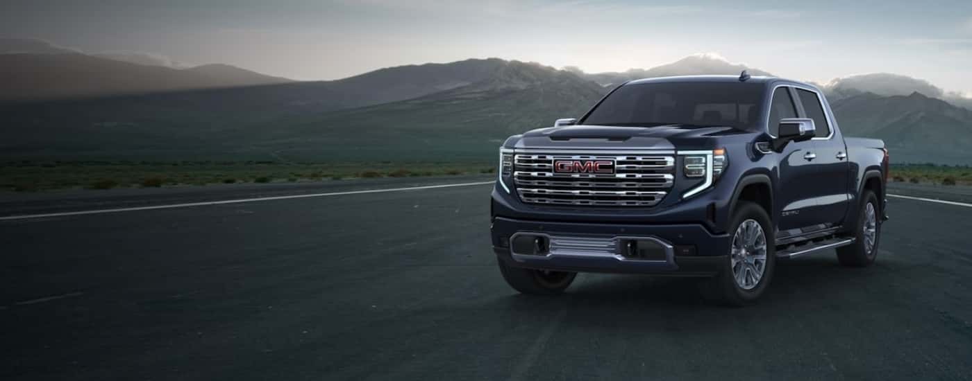 Black 2022 GMC Sierra 1500 Denali parked on an airstrip