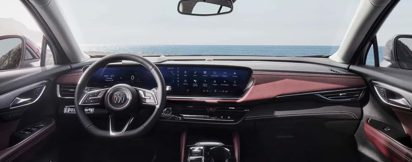 The steering wheel and dashboard in the interior of a 2026 Buick Envision.