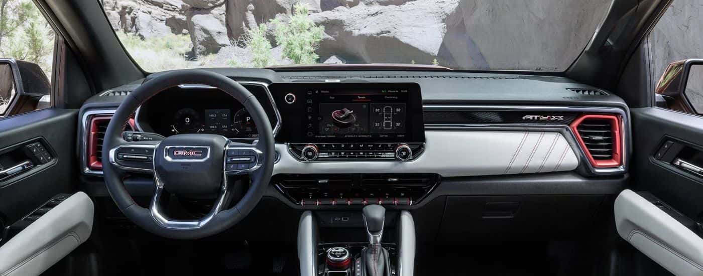 A 2026 GMC Canyon front view of infotainment, steering wheel and digital gauge cluster.