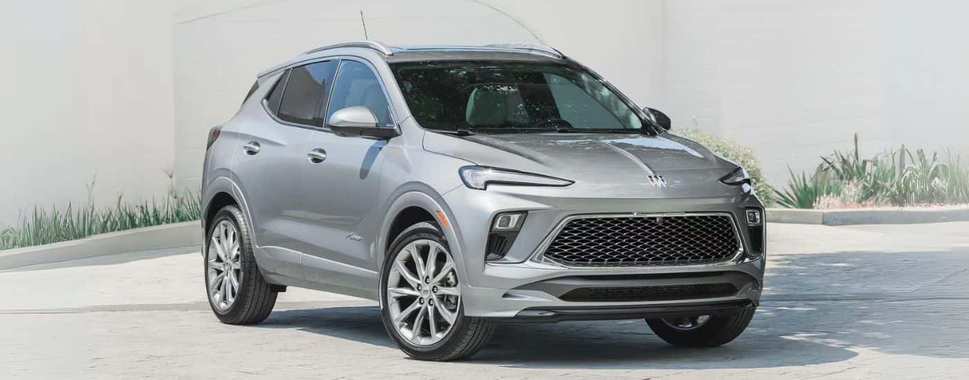 Silver 2025 Buick Encore GX Avenir parked at an angle