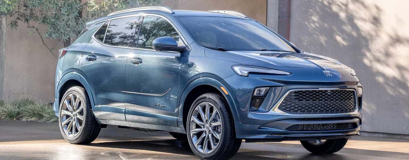 A blue 2026 Buick Encore GX parked in a driveway
