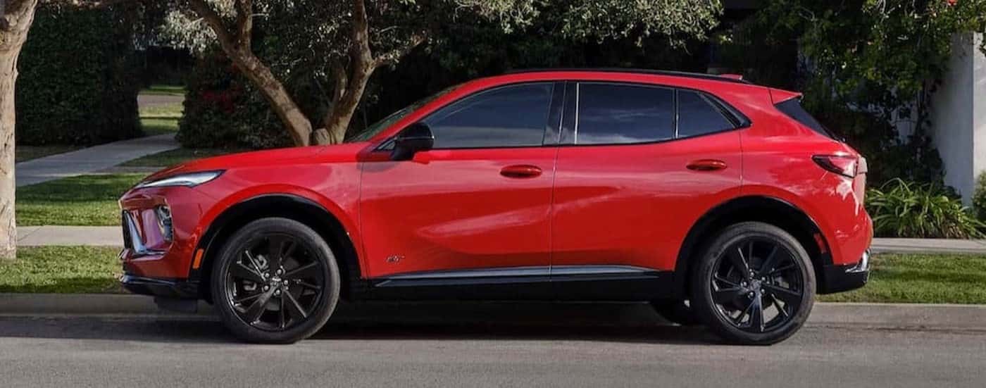 A red 2026 Buick Envision parked near a curb.