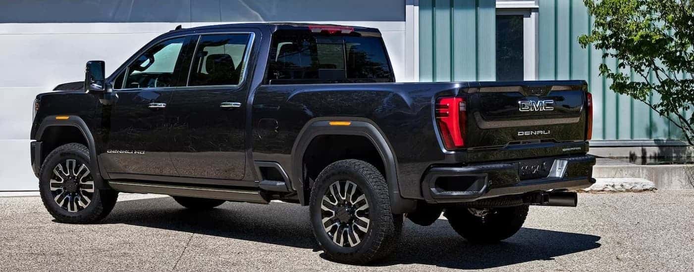 A black 2026 GMC Sierra 3500 Denali parked on a driveway.