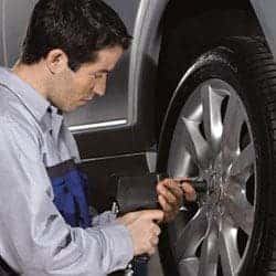 Mercedes-Benz technician working on a wheel