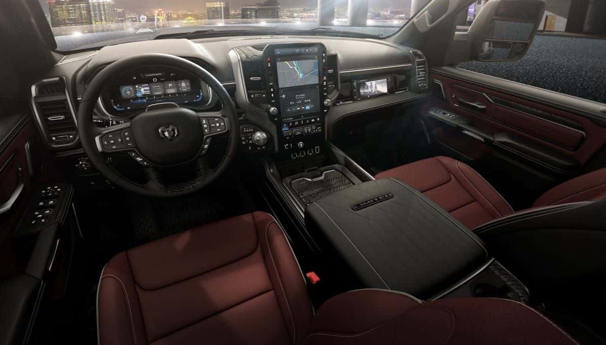 Steering wheel, digital cluster and burgundy leather seats in a 2026 Ram 1500 Limited cabin