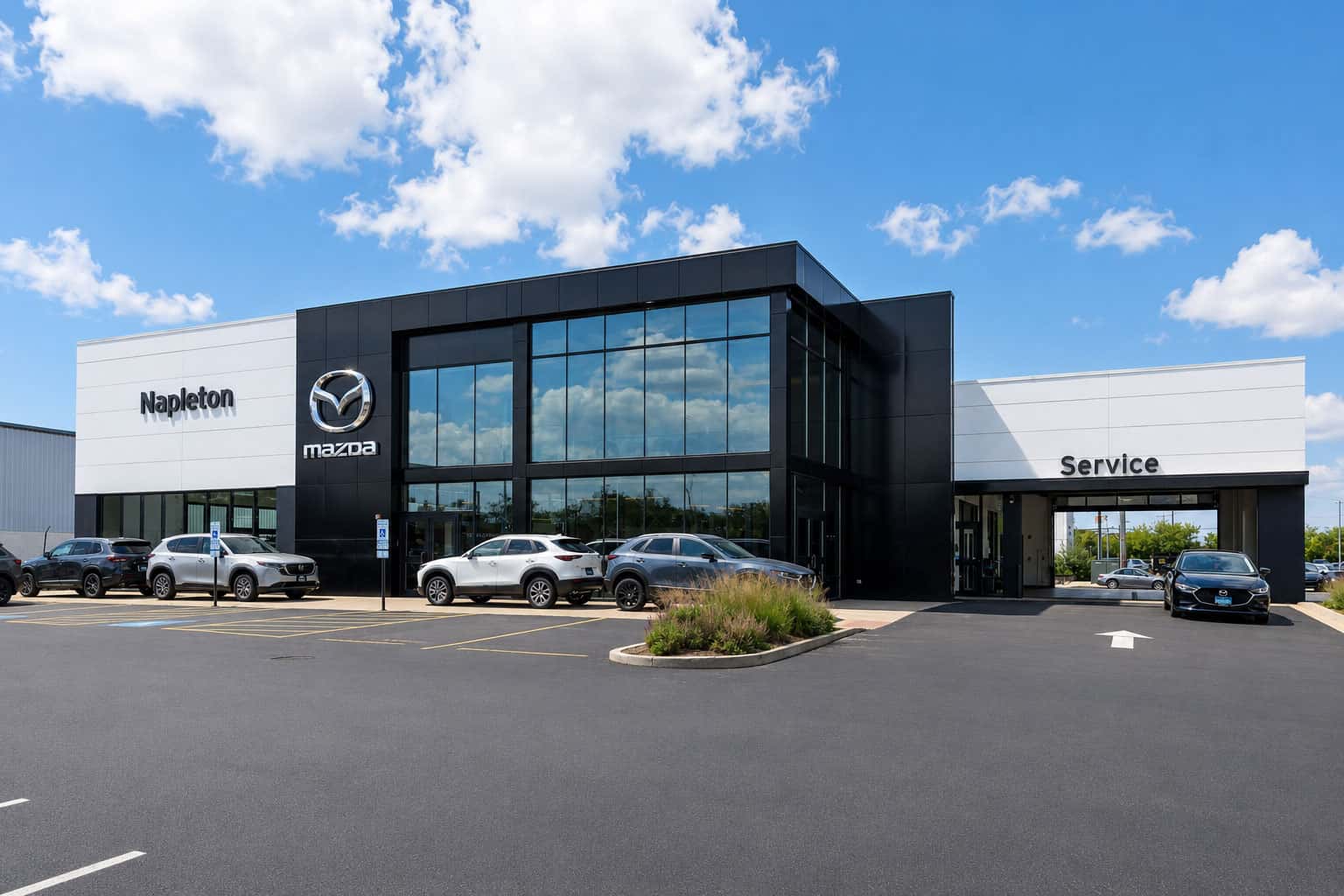 New Mazda CX-5 and CX-50 SUVs on a dealership showroom floor