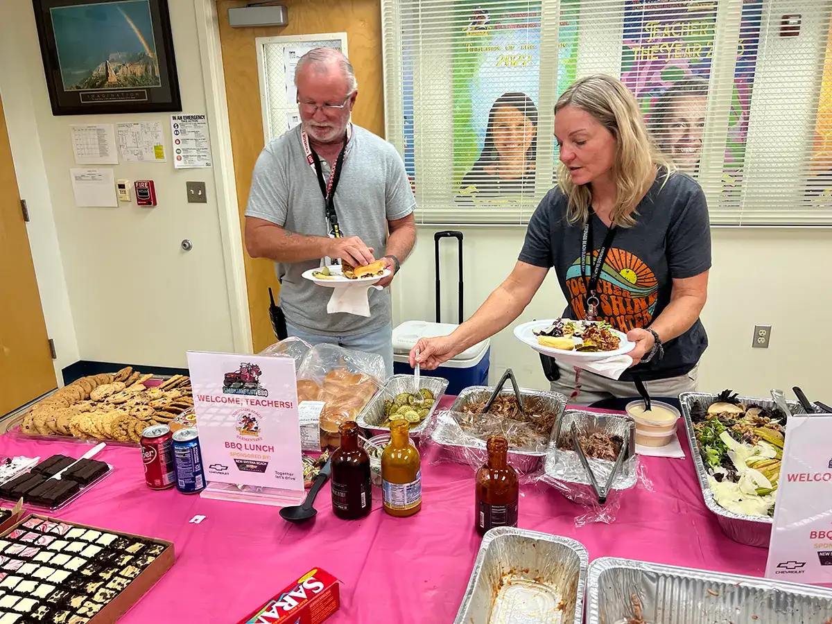 Community BBQ serving line at New Smyrna Beach Chevrolet