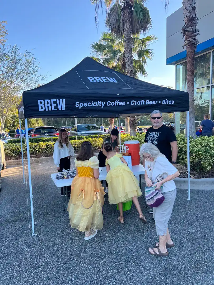 Brew Coffee tent and Halloween decorations at Trunk or Treat event