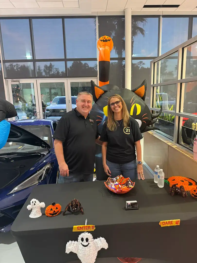 Bryan Roddy from Century 21 Real Estate sponsor table at Halloween Trunk or Treat