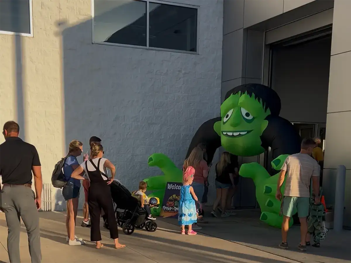 Large inflatable Frankenstein welcoming families to Halloween Trunk or Treat