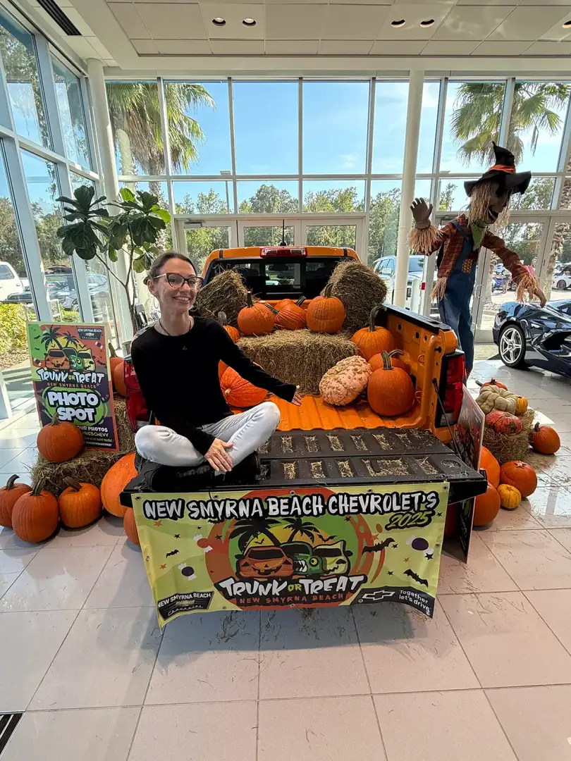 Crowds entering Halloween Trunk or Treat through inflatable Frankenstein