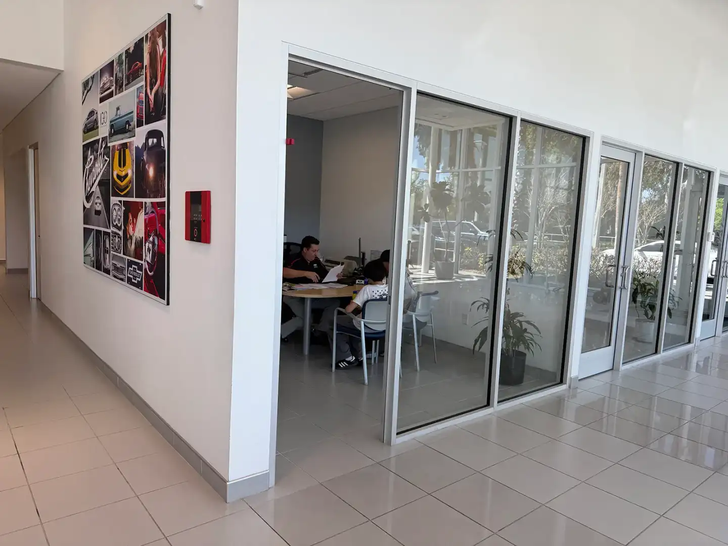 Customer discussing vehicle financing options with advisor at New Smyrna Beach Chevrolet in Florida