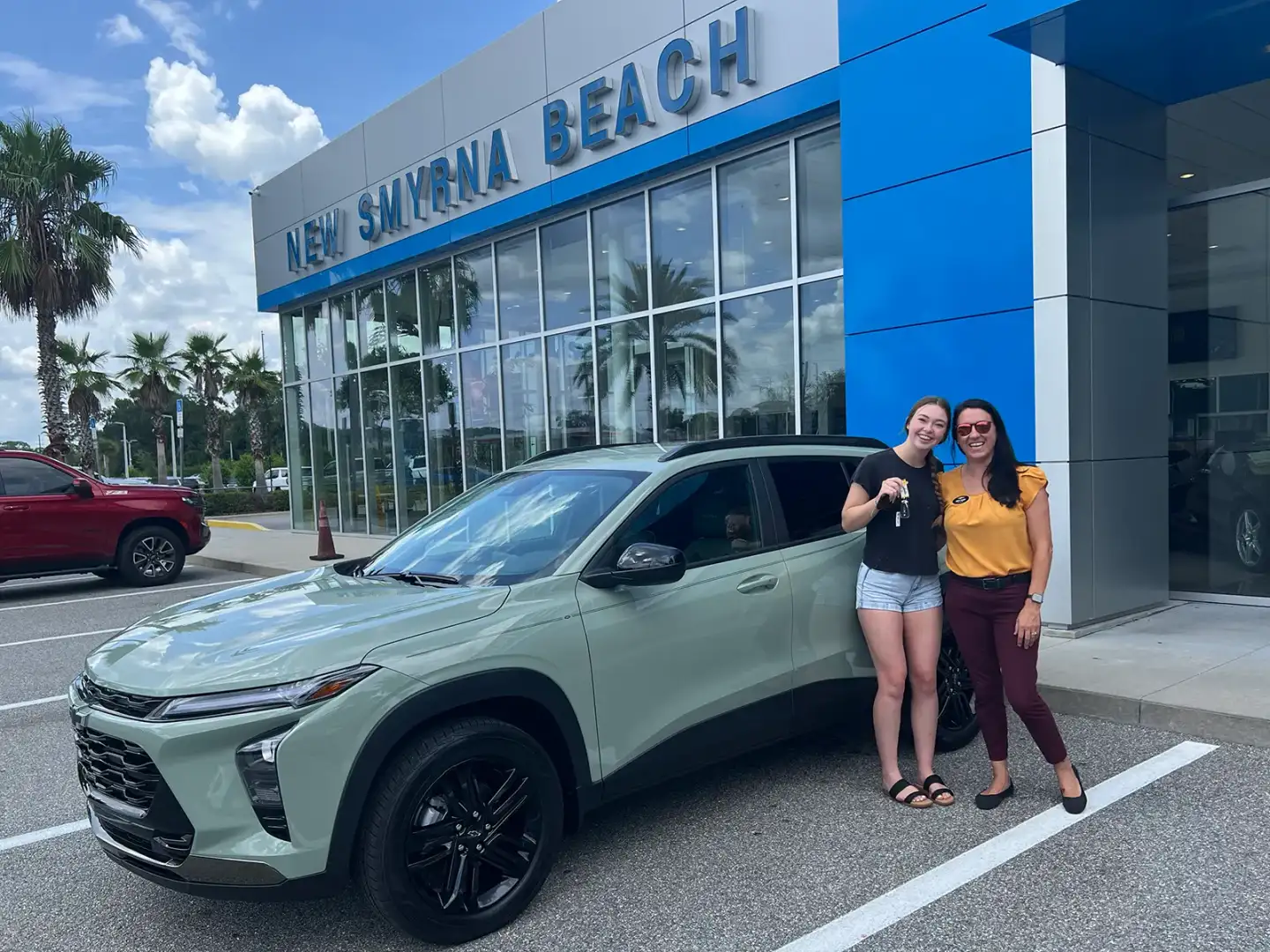 Customer reviewing vehicle options with a New Smyrna Beach Chevrolet advisor
