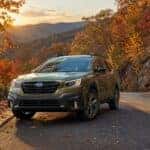 Hughes Subaru Subaru Road Trip Subaru Outback Image with fall foliage and mountain in the background on a road trip in Georgia mountains