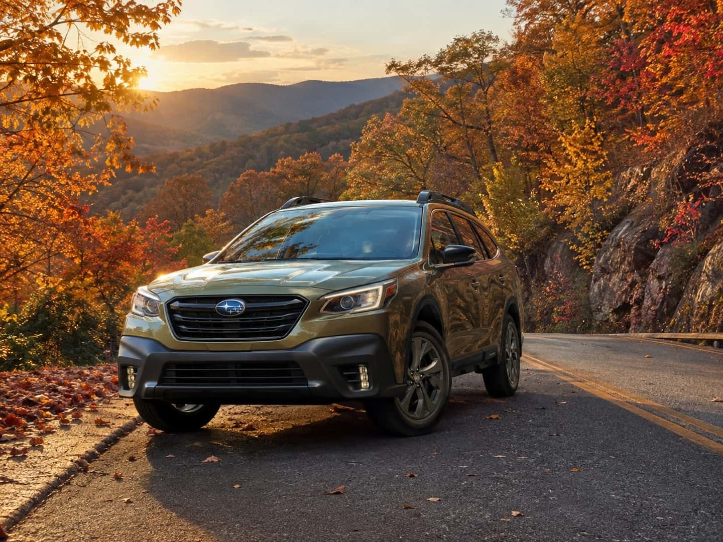 Hughes Subaru Subaru Road Trip Subaru Outback Image with fall foliage and mountain in the background on a road trip in Georgia mountains