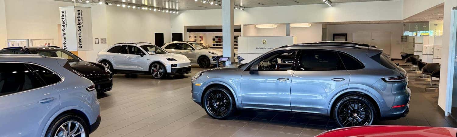 Porsche Greensboro showroom featuring Cayenne and Macan models